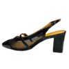 Zapatos tipo sandalia Vizzano color negro con tacón grueso y detalles transparentes.